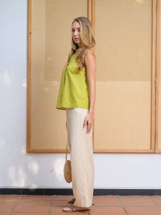 Sleeveless button sown blouse