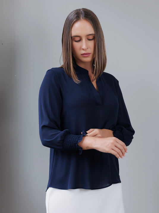 Blouse with smocked cuff