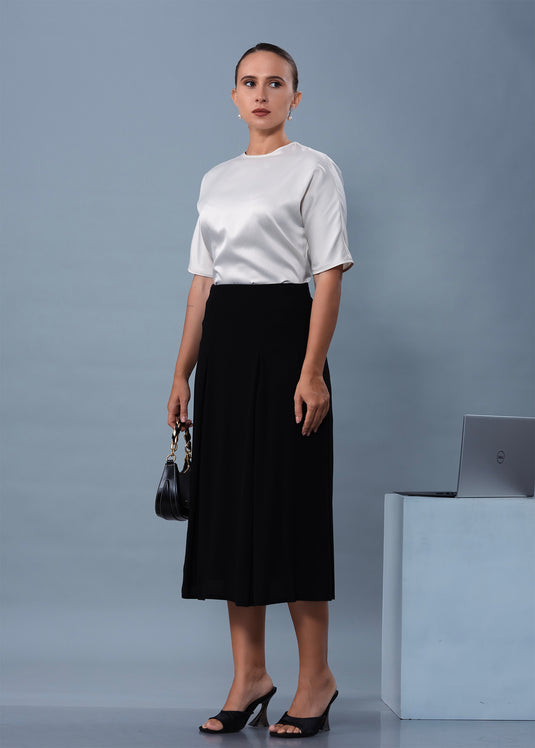Midi length skirt with inverted pleats