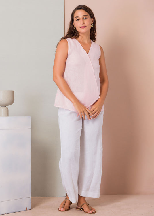 Sleeveless blouse with mock cross over panel