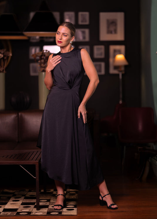 Sleeveless asymmetrical dress with side drape