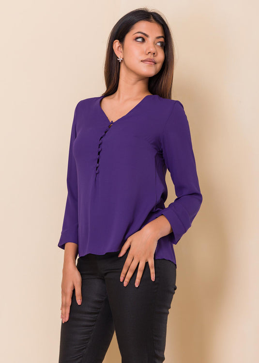 V neck blouse with covered buttons