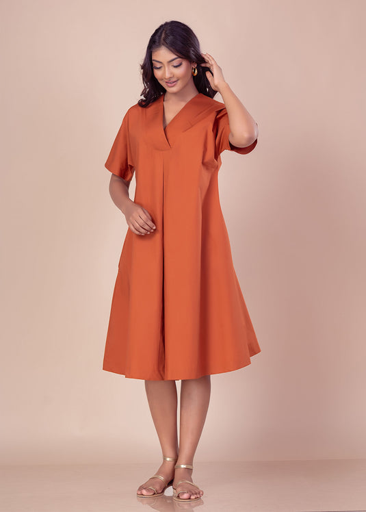 Knee length V neck dress with front pleat