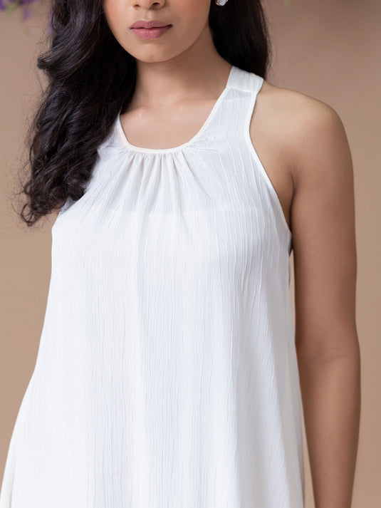 Halter dress with asymmetrical hem