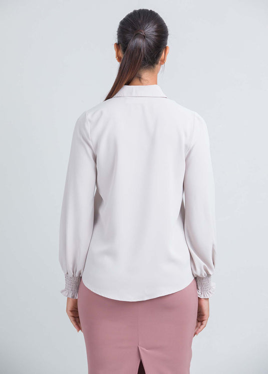 Long sleeve blouse with smocked cuff