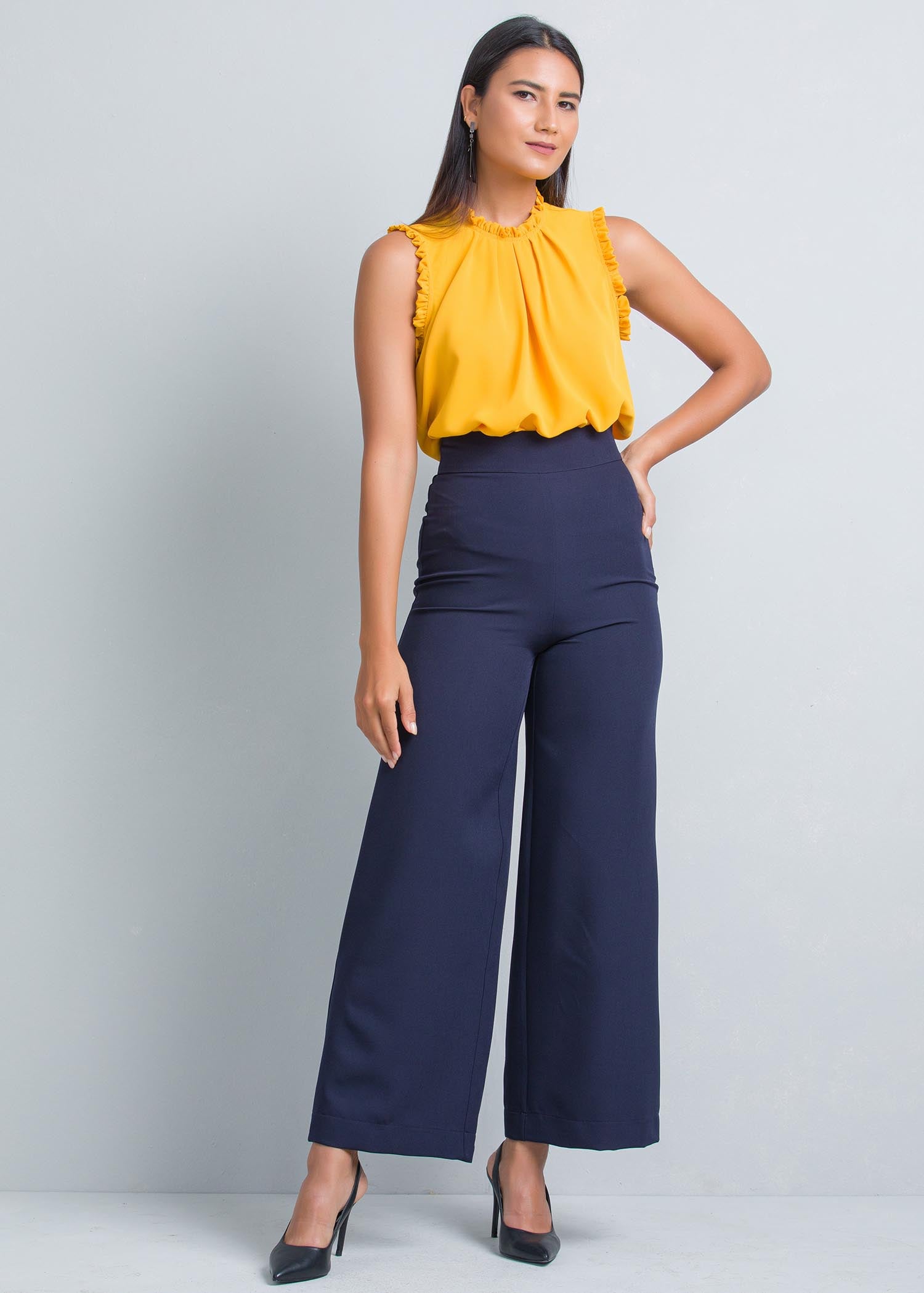 Sleeveless blouse with frill and pleat detailing