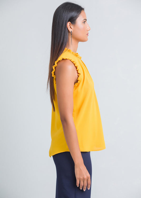 Sleeveless blouse with frill and pleat detailing