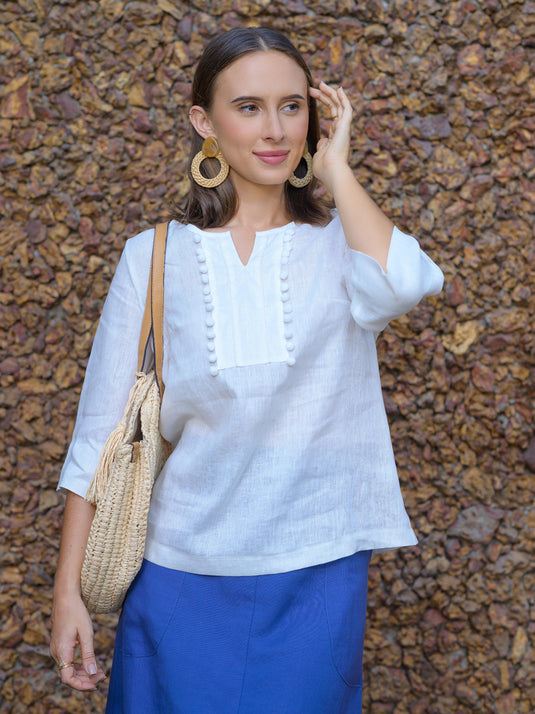 Round neck blouse with pom pom lace detail