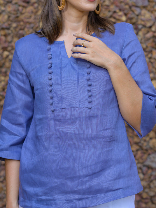 Round neck blouse with pom pom lace detail