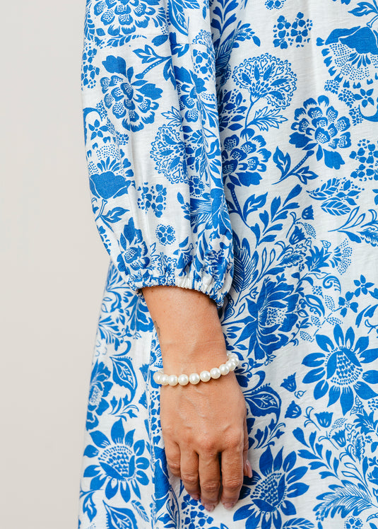 Printed V neck dress with draw cord detailing