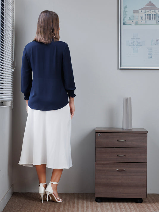 Blouse with smocked cuff