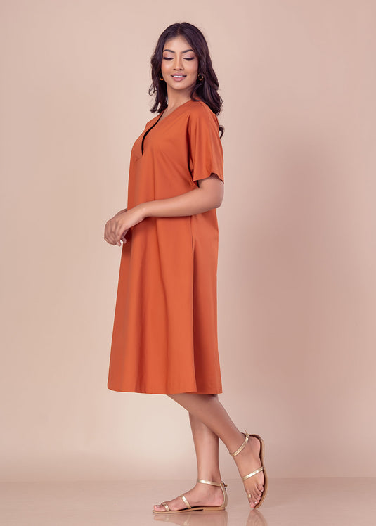 Knee length V neck dress with front pleat