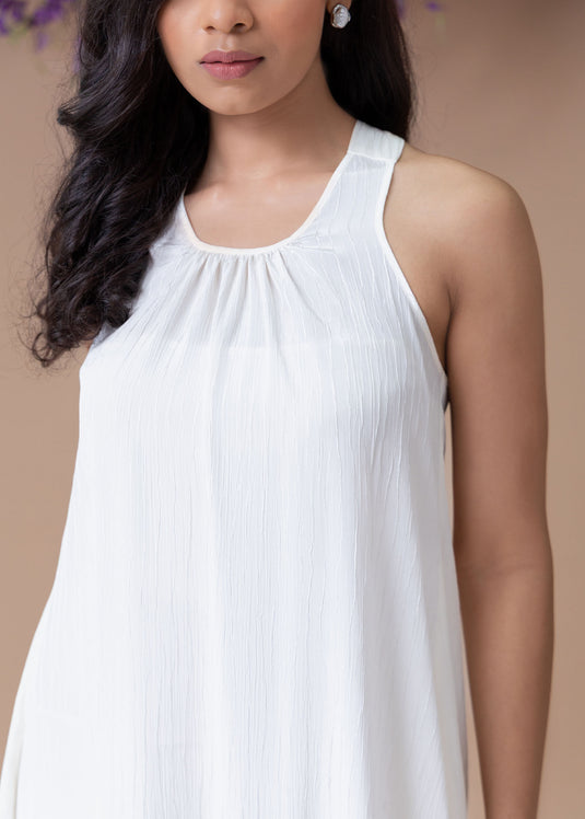 Halter dress with asymmetrical hem