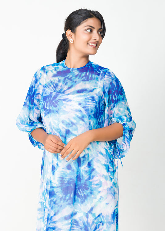 Uneven hem detailed printed dress